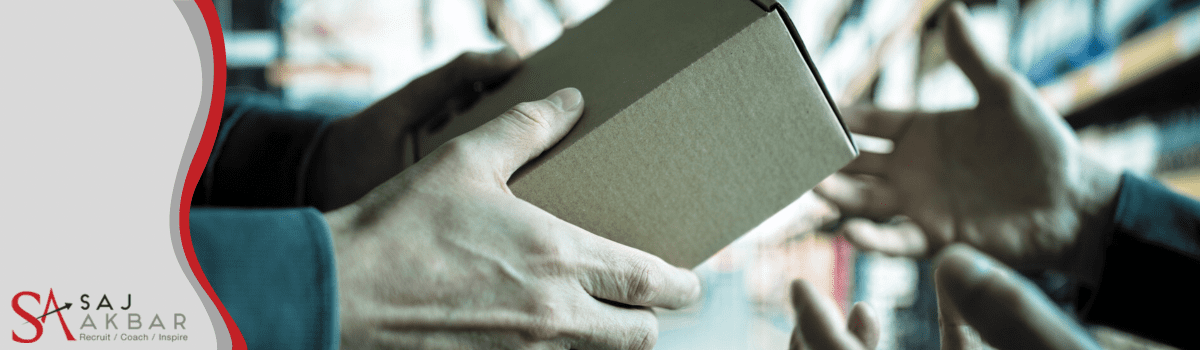 Someone handing a box to another person