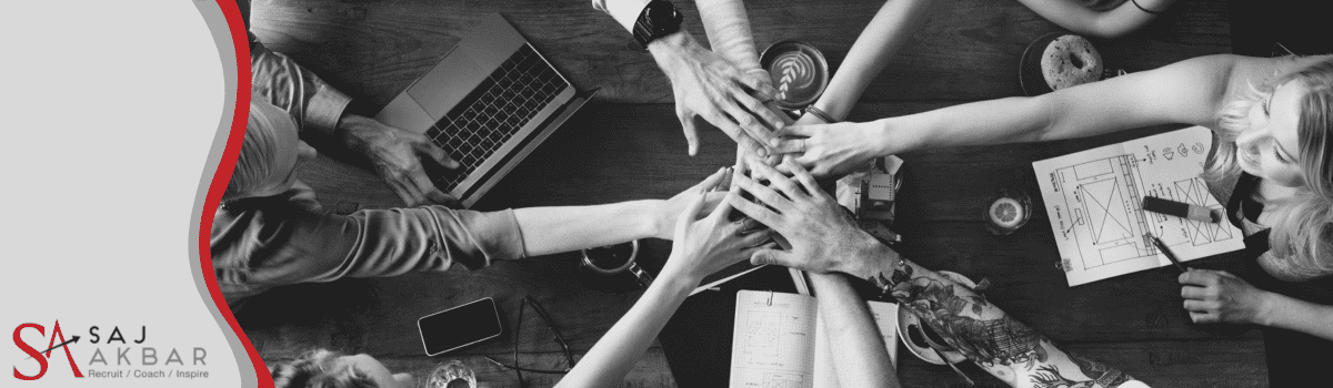 Business meeting all hands in the middle